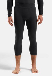 Schwarze Rippleggins mit einer enganliegenden Passform, ausgestattet mit einem hohen Bund und kürzerer Länge, aus dehnbarem, strukturiertem Stoff.