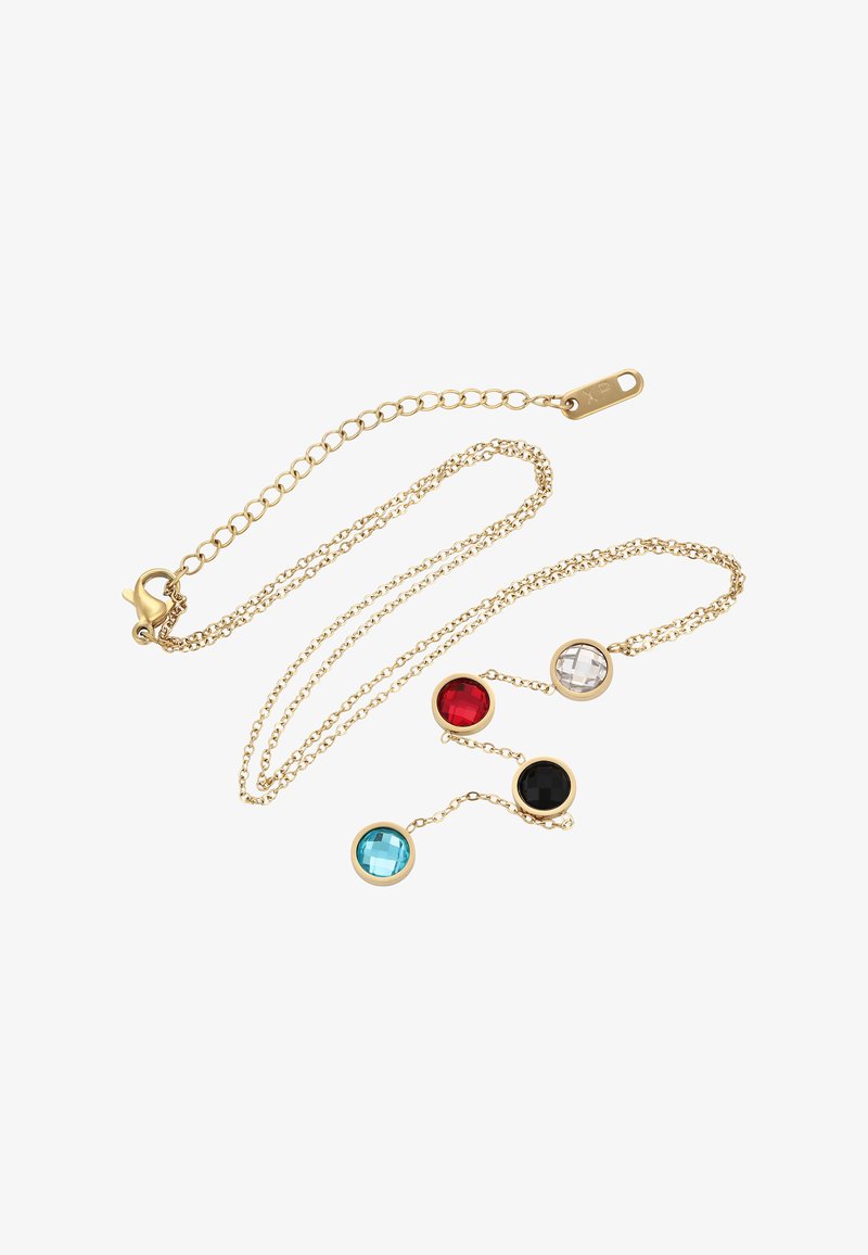 Kultaketju, jossa on neljä pyöreää fasetoitua jalokiveä sinisessä, punaisessa, mustassa ja kirkkaassa, jotka on linkitetty ketjulle hämähäkkilukolla.