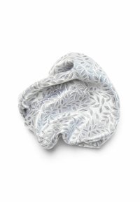 Silver fabric scrunchie with an embossed leaf pattern, soft texture, and gathered design for secure hair styling.