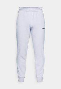 Light purple sweatpants made of soft fabric, featuring an elastic waistband and cuffs, with a small black logo on the left side.