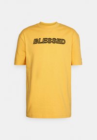 Puma NJR TEE - T-shirts med print - mimosa