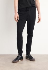 BOSS - SESTART - Tracksuit bottoms - black Thumbnail Image 1