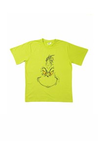T-shirt verde brillante a maniche corte con un grande viso illustrato del Grinch in nero e giallo, centrato sulla parte anteriore.