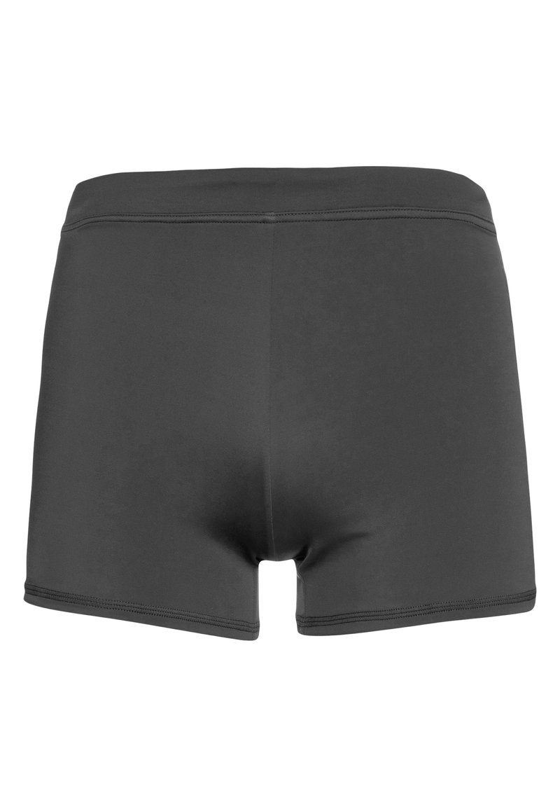 Tmavomodré plavky vyrobené z hladkého materiálu, s krátkym strihom, jednoduchým dizajnom a jemnými detailami prešitia.