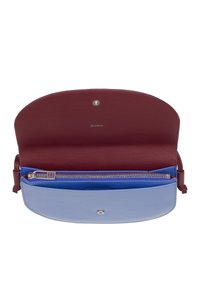 Two-tone leather handbag with a maroon exterior and a light blue interior. Features a zip pocket and a snap closure. Smooth texture throughout.
