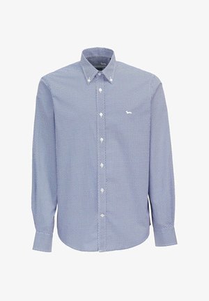 Blå skjorte med knapper og et lille geometrisk mønster, lange ærmer og en klassisk krave. Har en enkelt hvid logo på venstre bryst.
