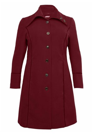 Manteau bordeaux en tissu lisse, avec un col, six boutons sur le devant et des détails sur les coutures latérales. Manches longues, coupe ajustée.