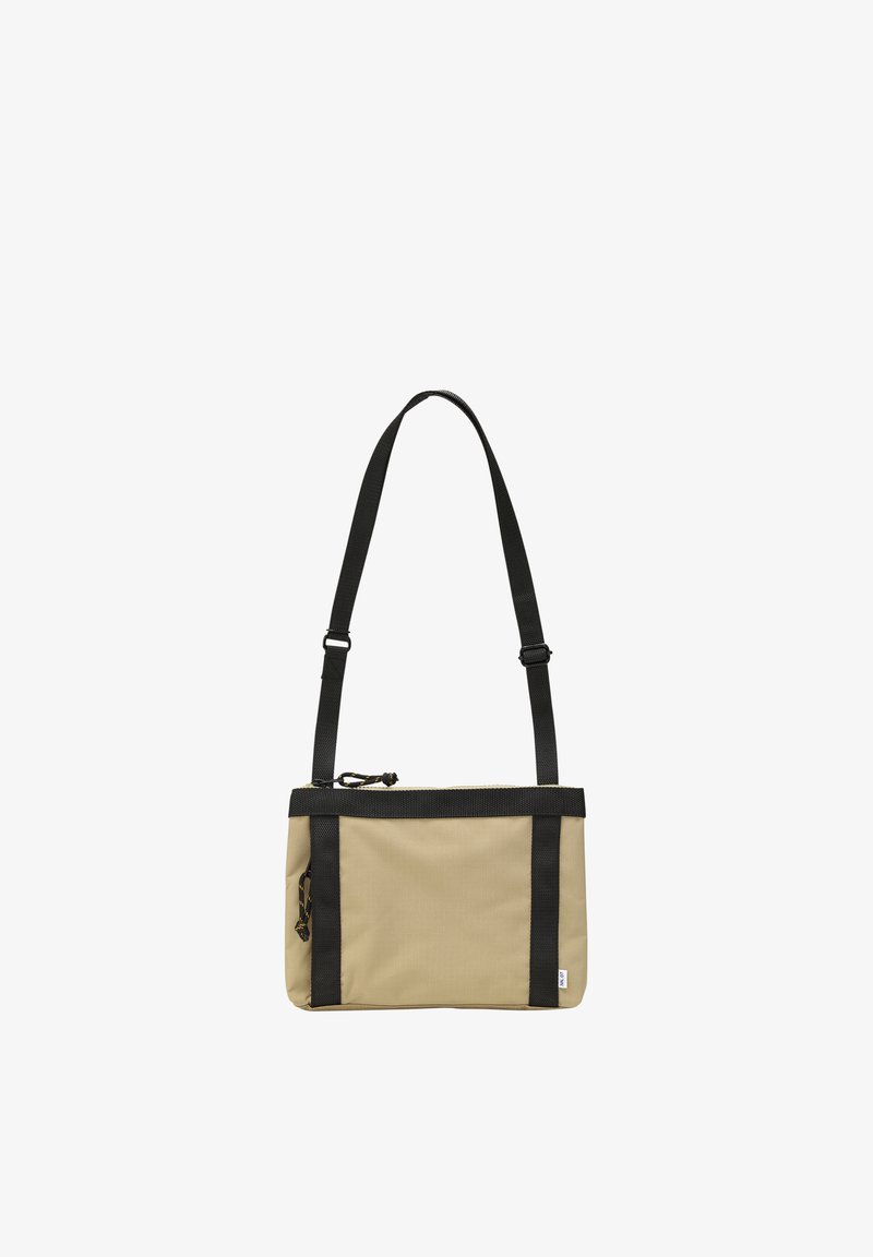 Sac bandoulière rectangulaire beige avec bandoulière réglable noire et garniture, comprenant un compartiment principal zippé et un détail de tirette latérale zippée.