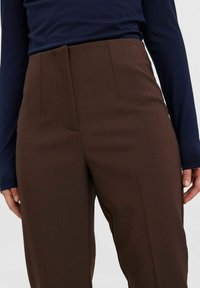 Vero Moda Petite straight leg trousers in black