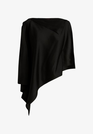 Top nero asimmetrico con maniche lunghe, tessuto drappeggiato e orlo irregolare che si assottiglia verso un'estremità appuntita.