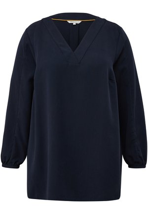Marineblauwe blouse van zachte stof met een V-hals en lange, licht geraffineerde mouwen; heeft een minimalistisch ontwerp zonder patronen of accenten.