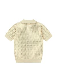 Polo a maniche corte in maglia crema con colletto a costine e motivo testurizzato, caratterizzato da righe verticali e una vestibilità rilassata.