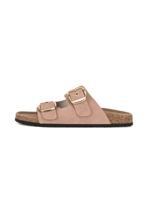 Pink suede slide sandal with two adjustable gold buckles, cork footbed, and textured black sole. Open-toe design and minimalist style.