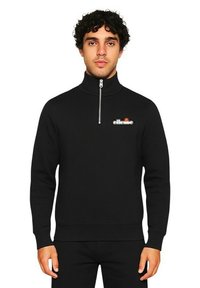 Sweatshirt noir zippé en mélange de coton, avec un col montant et un logo sur la poitrine. Texture lisse avec poignets et ourlet côtelés.