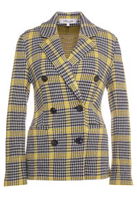 Dvojřadý blazer s černo-bílým kostkovaným vzorem, doplněný žlutými liniemi. Obsahuje černé knoflíky a klopové límce.