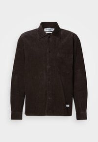 Brown corduroy shirt with a button-down collar, front pocket, and black buttons. Features vertical ribs and a subtle texture.