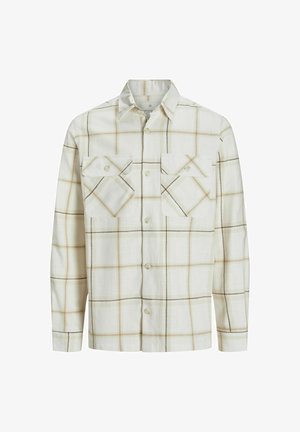 Långärmad skjorta i ljus beige tyg med rutigt mönster och bruna accenter, två bröstfickor och krage.