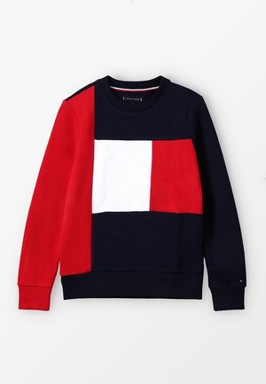Pull ras du cou avec motif en blocs bleu marine, rouge et blanc, doté de poignets et d'un ourlet côtelés.