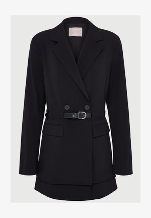 Black double-breasted blazer with a belted waist, two front pockets, and wide lapels; made of textured fabric with a structured shape.
