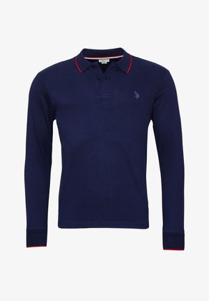Námornícky dlhý rukáv polo tričko s červeným golierom a akcentmi na rukávoch. Obsahuje dvojitý gombíkový zapínací priehľad a malú vyšívanú logo na ľavej hrudi.