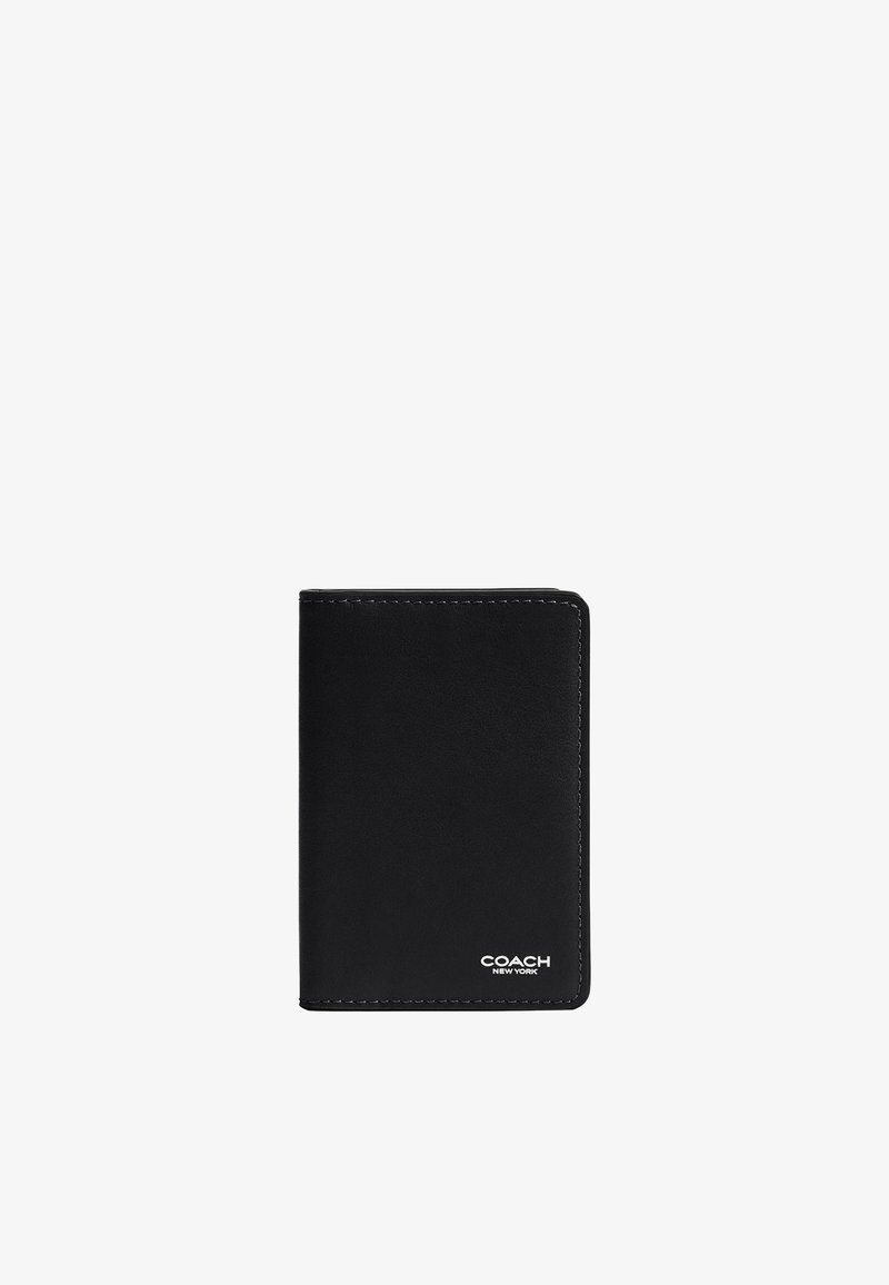 Porte-cartes Coach en cuir noir avec bords cousus et logo "Coach New York" en blanc en bas à droite.