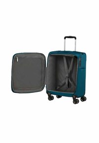 Valigia rigida color turchese con manico telescopico, quattro ruote e un interno grigio con cinghie e un compartimento con zip.