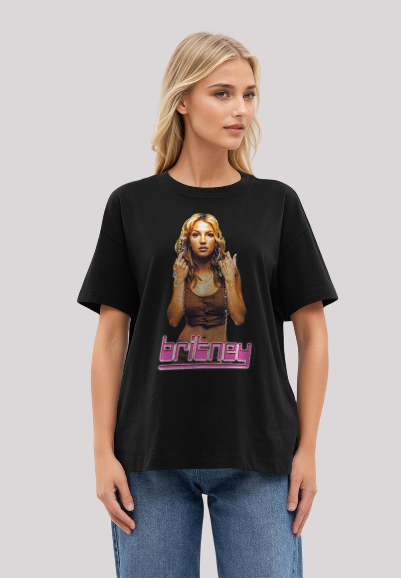 Black cotton T-shirt featuring a graphic print of a woman with long hair and the name "britney" in pink at the bottom. Short sleeves, relaxed fit.