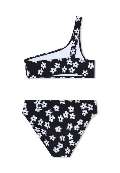 Bikini noir avec un haut à une épaule orné de motifs floraux blancs et un bas hipster assorti. Confectionné en tissu extensible.