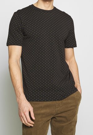 Black short-sleeve t-shirt with a round neck, featuring a pattern of small gold dots. Fabric appears smooth and lightweight.