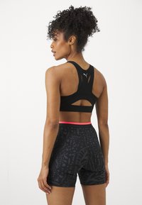 Puma SHAPELUXE  - Sujetadores deportivos con sujeción alta - black