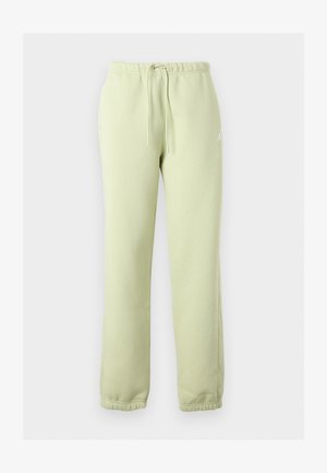 Hele rohelised dressipüksid, millel on elastne vöökoht ja mansetid, küljetaskud, nöörsilmus ja väike valge logo paremal puusal.