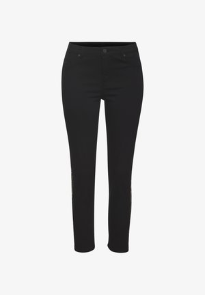 Pantalones negros de corte ajustado, fabricados en material elástico. Cuentan con un acabado suave y detalles decorativos a lo largo de las costuras laterales.