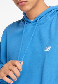 New Balance SPORT ESSENTIALS FRENCH TERRY - Hoodie - blue light blue