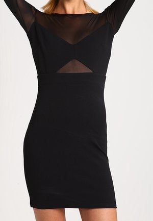 Zwart bodycon jurk met een doorschijnende mesh top, met lange mouwen en een geometrische uitsnijding op de borst. Gladde textuur, aansluitende pasvorm.