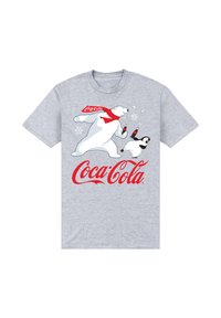 T-shirt grigia con una grafica di un orso polare e un pinguino, entrambi che tengono bottiglie di Coca-Cola, con il logo rosso di Coca-Cola e fiocchi di neve bianchi.
