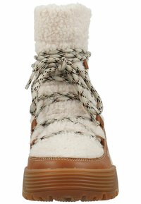 Botas marrones impermeables con parte superior de crema de pelo sintético, cordones con patrón y suela de goma gruesa. Cuenta con un collar acolchado para mayor comodidad.