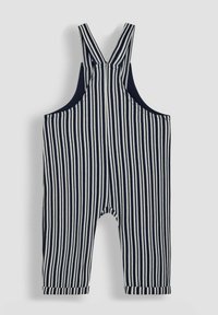 Gestreifte Latzhose in Marineblau und Weiß, aus weichem Stoff. Verfügt über breite Träger, einen abgerundeten Ausschnitt und hochgekrempelte Bündchen an den Knöcheln.