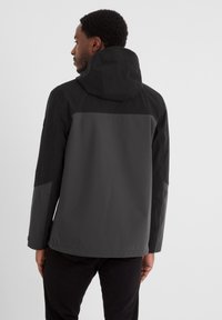 Dark gray hooded jacket with contrasting black upper sections, smooth texture, and a minimalist design, shown from the back.