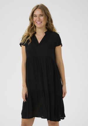 Black, short-sleeve dress with a v-neck, layered design, and a flowing skirt. Made from lightweight fabric, featuring a gathered waist.