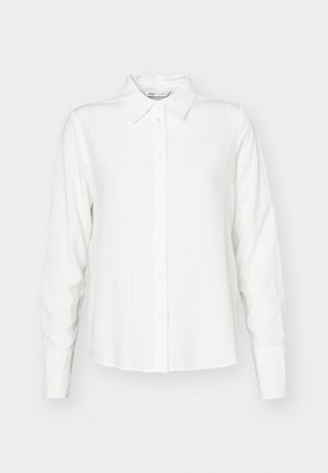 Valkoinen, pitkähihainen nappipaitamalli, jossa on kaulus, valmistettu sileästä kankaasta; siinä on suora leikkaus ja hienovarainen rakenne.