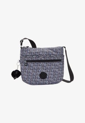 Shoulder bag in navy and white patterned fabric, featuring a front zip pocket, adjustable strap, and a pom-pom charm attached.