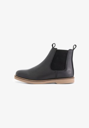 Bottines Chelsea en cuir noir avec panneaux élastiques sur les côtés, bout arrondi et semelle en caoutchouc beige. Équipées de languettes pour un enfilage facile.