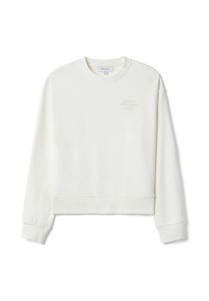 Weißes Sweatshirt mit Rundhalsausschnitt und langen Ärmeln, Rippbündchen an Ärmelenden und Saum, mit kleinem beigem Text "New York 1997" auf der oberen linken Brust.