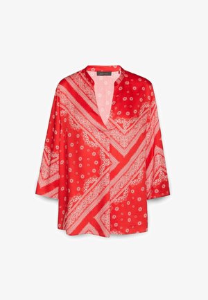Camicia in stile kimono rossa con motivo paisley bianco. Presenta un collo a V, maniche a tre quarti e una vestibilità comoda. Tessuto di alta qualità e morbido.