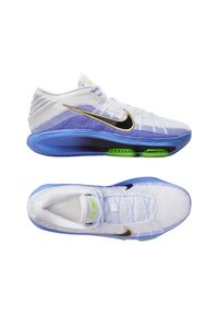 Nike sportschoenen met een bovenwerk van wit en paars gaas, zwarte swoosh, blauwe zool en groene accenten, met een textuurafwerking en een gevoerde zool.