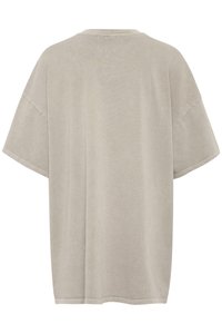 Light grey oversized t-shirt with short sleeves, crew neck, and a soft, smooth texture. Simple design and no visible patterns or embellishments.