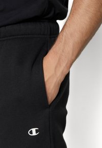 Champion BASIC CUFF PANTS - Tepláky - black