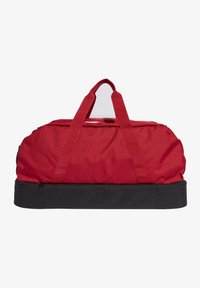 Bolsa de viaje roja con base negra, fabricada en un tejido resistente. Cuenta con dos asas superiores y un cierre de cremallera, con un diseño redondeado.