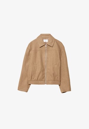 Veste marron à col, avec fermeture éclair à l'avant, taille élastique et poches latérales. Confectionnée dans un tissu texturé, elle présente une coupe décontractée et un design minimaliste.
