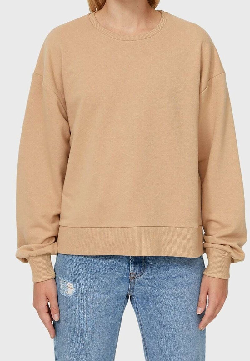Beige sweatshirt made from soft material with a round neckline, dropped shoulders, and a loose fit, featuring ribbed cuffs and hem.